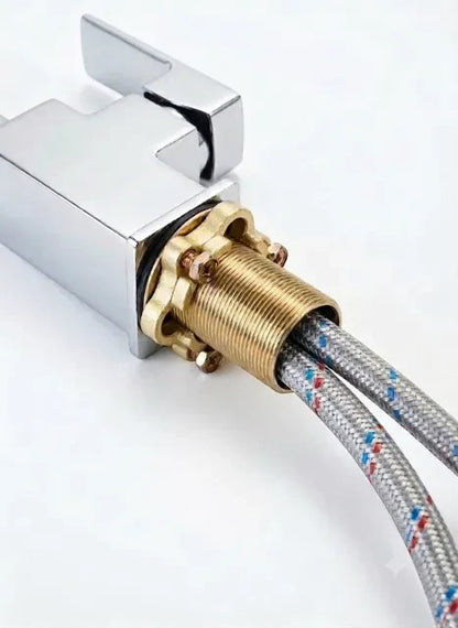 Onyx Elements modern chrome kitchen faucet with high arc spout and braided water hoses.