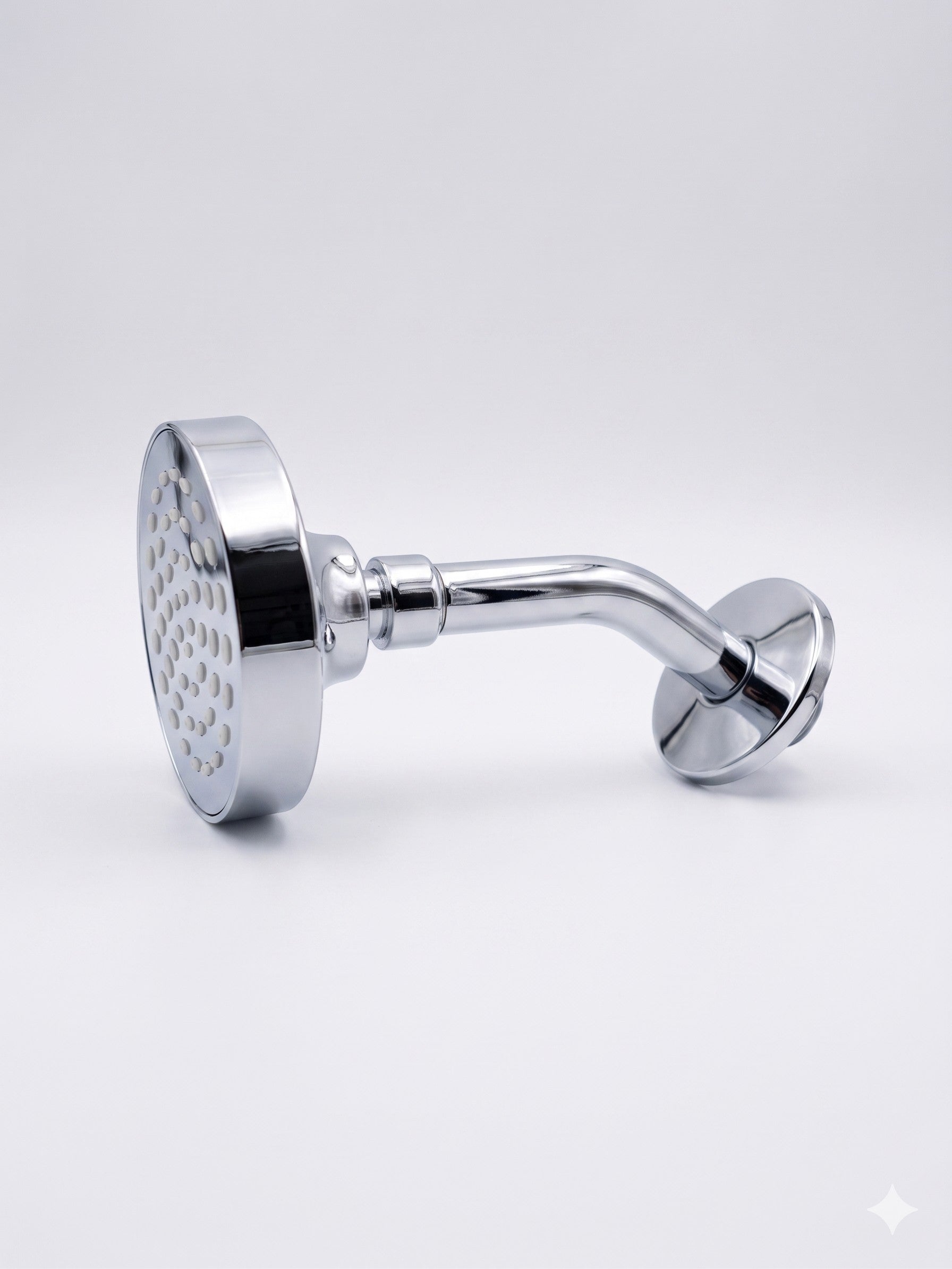 Onyx Elements polished chrome wall-mounted shower head with a modern minimalist design and circular spray face.