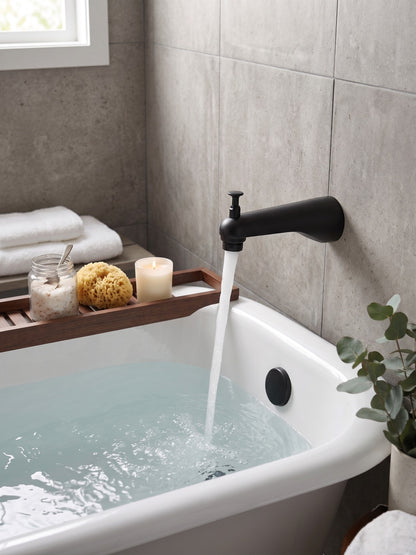 Onyx Elements matte black bathtub spout with diverter installed over a white tub in a modern bathroom setting.