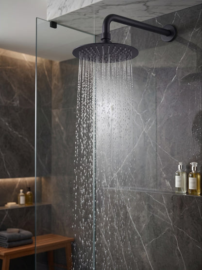 Onyx Elements matte black rainfall shower head mounted in a modern grey marble shower with water flowing