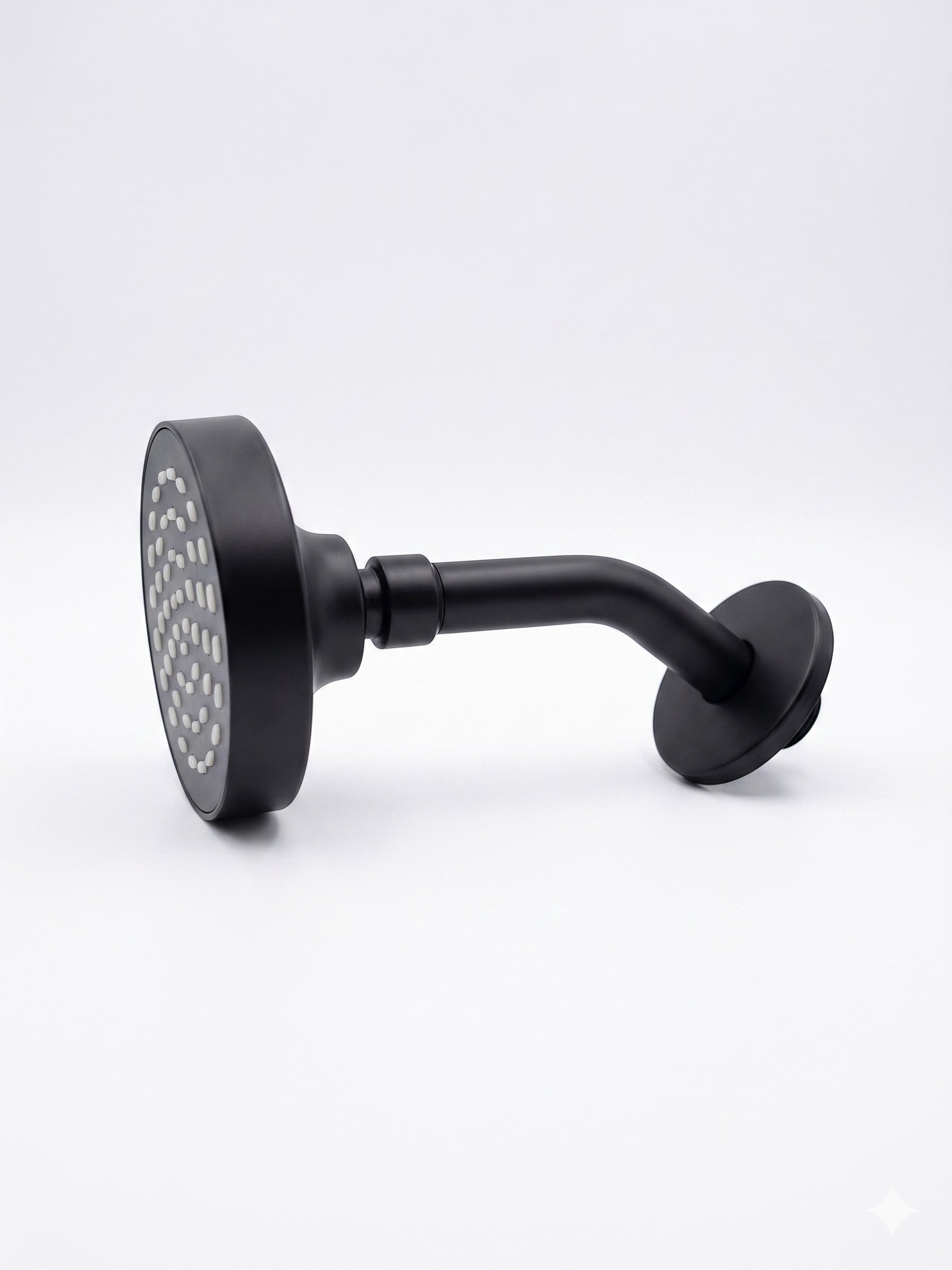 Onyx Elements matte black wall-mounted shower head with a modern minimalist design and circular spray face.