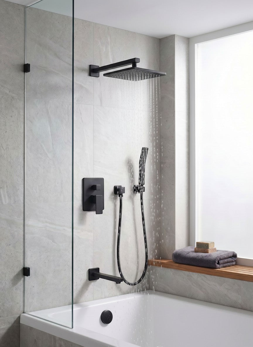 Onyx Elements matte black square rainfall shower system with handheld wand and tub spout in a modern tiled bathroom.