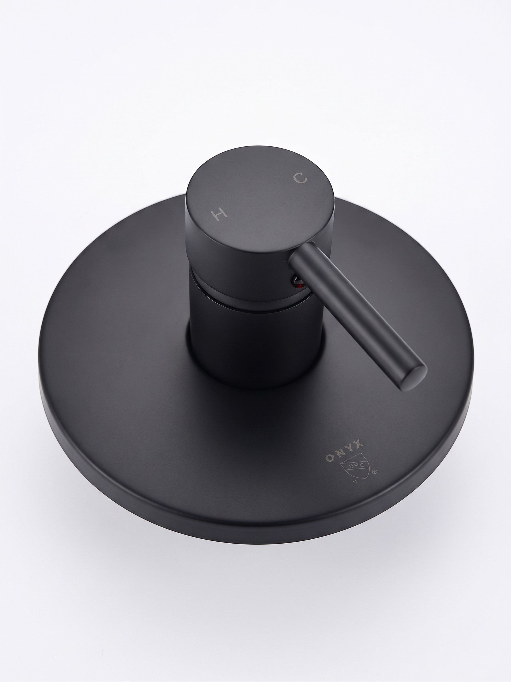 Onyx Elements matte black single-handle shower control valve with a modern minimalist circular trim plate