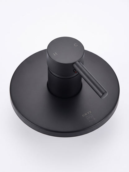 Onyx Elements matte black single-handle shower control valve with a modern minimalist circular trim plate